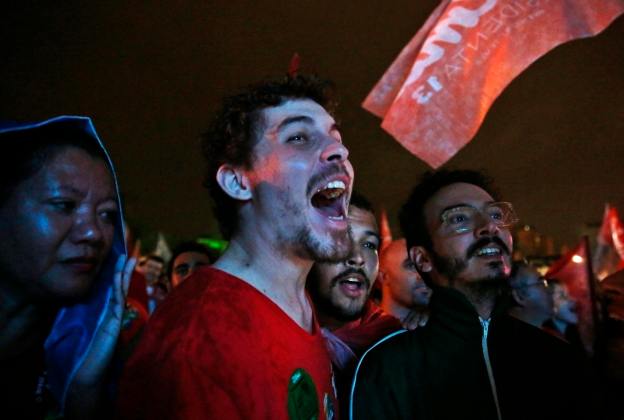 Supporters of Brazil's President and Workers' Party (PT) presidential candidate Rousseff, react to the first results of the Brazil general elections in Rio de Janeiro