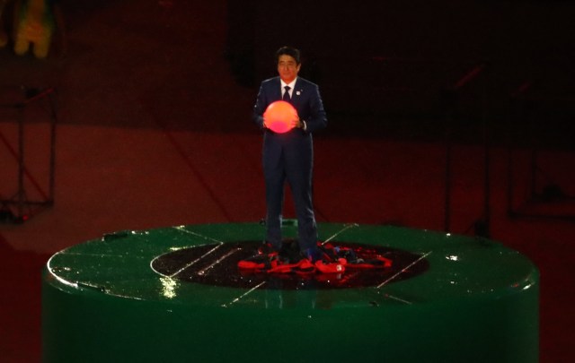 2016 Rio Olympics - Closing ceremony - Maracana - Rio de Janeiro, Brazil - 21/08/2016. Japan's Prime Minister Shinzo Abe takes part in the flag handover ceremony. The 2020 Olympics will be held in Tokyo, Japan. REUTERS/Yves Herman FOR EDITORIAL USE ONLY. NOT FOR SALE FOR MARKETING OR ADVERTISING CAMPAIGNS.