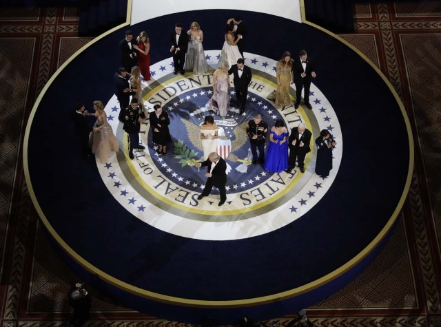 President Donald Trump gives the thumbs up after dancing during the Salute to Armed Forces Ball for President Donald Trump at the National Building Museum in Washington, Friday, Jan. 20, 2017. (AP Photo/David J. Phillip)