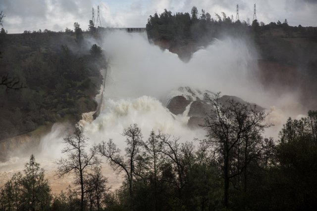 65,000 cfs of water flow through a damaged spillway on the Oroville Dam in Oroville, California, U.S., February 10, 2017. REUTERS/Max Whittaker