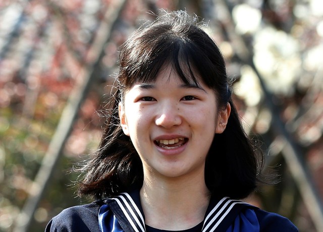 Japan's Princess Aiko smiles as she attends her graduation ceremony at the Gakushuin Girls' Junior High School in Tokyo, Japan, March 22, 2017. REUTERS/Issei Kato