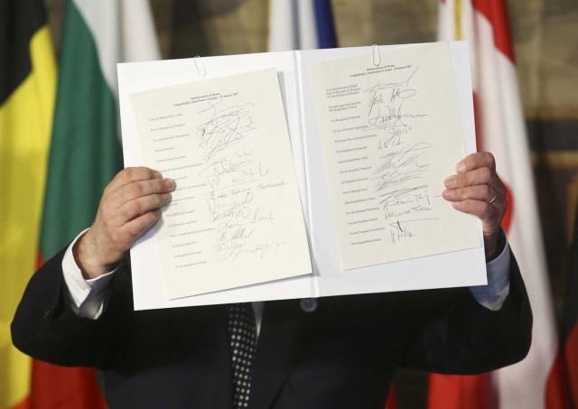 European Parliament President Antonio Tajani holds up a document signed by EU leaders during their meeting on the 60th anniversary of the Treaty of Rome, in Rome, Italy March 25, 2017. REUTERS/Remo Casilli TPX IMAGES OF THE DAY