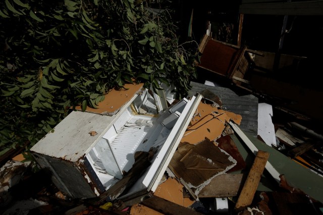 A damaged refrigerator is seen near a house destroyed by a mudslide after Storm Nate in the outskirts of San Jose, Costa Rica October 6, 2017. REUTERS/Juan Carlos Ulate