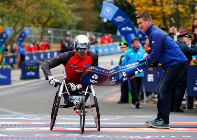 Marcel Hug of Switzerland crosses the finish line of the New York City Marathon to win the wheelchair race in Central Park in New York, U.S., November 5, 2017. REUTERS/Brendan McDermid