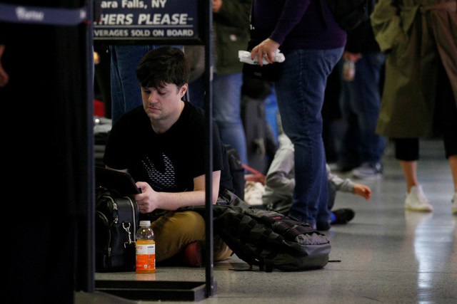 Passengers wait to board an Amtrak trains ahead of the Thanksgiving Day holiday, at Pennsylvania Station in New York City, U.S., November 22, 2017. REUTERS/Brendan McDermid