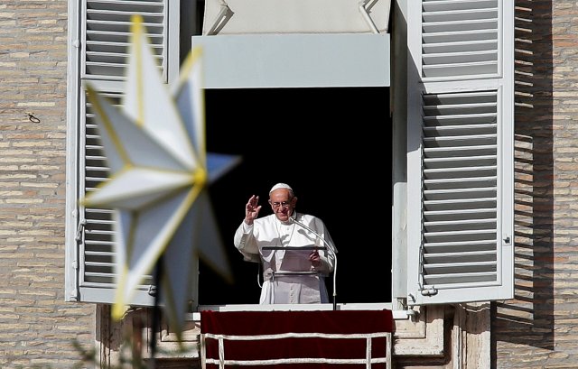 The star atop the Vatican Christmas tree is seen as Pope Francis leads the Angelus prayer in Saint Peter's Square at the Vatican November 26, 2017. REUTERS/Max Rossi