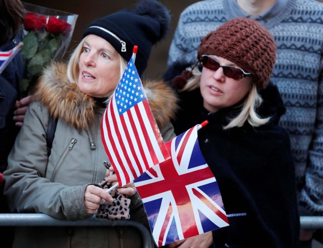 People hold U.S. and British flags as they wait for Britain's Prince Harry and his fiancee Meghan Markle to attend an event in Nottingham, December 1, 2017. REUTERS/Eddie Keogh