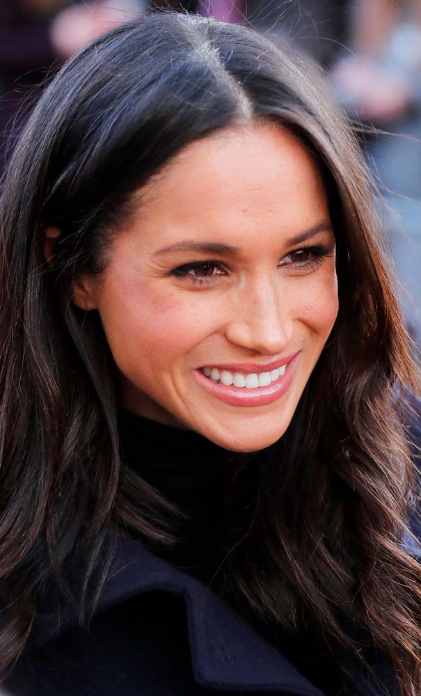Meghan Markle greets well wishers as she arrives at an event with her fiancee Britain's Prince Harry in Nottingham, December 1, 2017. REUTERS/Eddie Keogh
