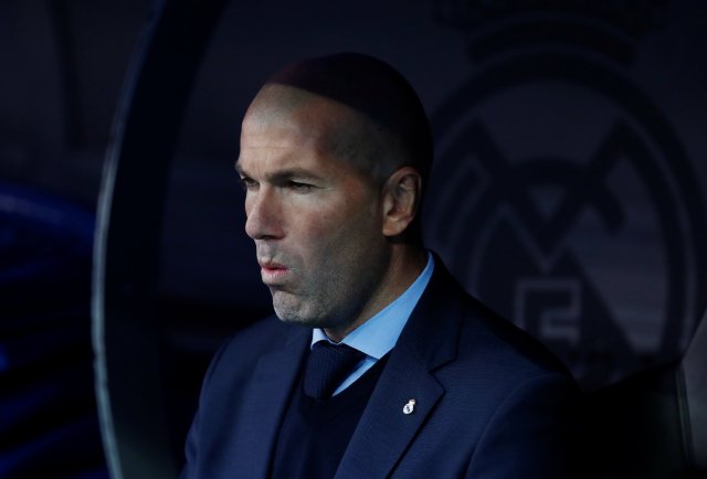 Soccer Football - La Liga Santander - Real Madrid vs FC Barcelona - Santiago Bernabeu, Madrid, Spain - December 23, 2017   Real Madrid coach Zinedine Zidane looks on   REUTERS/Juan Medina