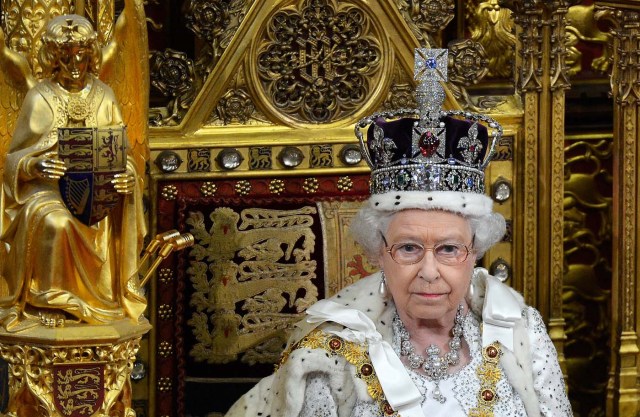 FILE PHOTO: Britain's Queen Elizabeth waits before delivering her speech in the House of Lords, during the State Opening of Parliament at the Palace of Westminster in London, Britain, May 8, 2013. REUTERS/Toby Melville/File Photo