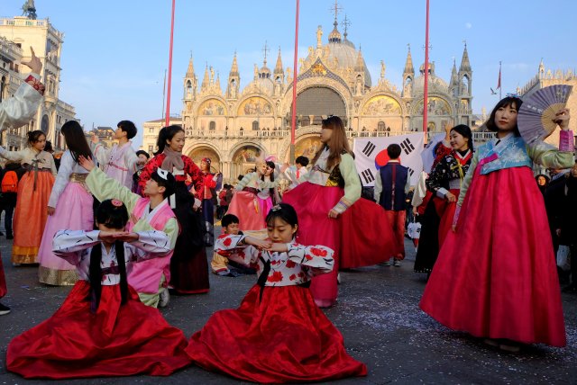 Dancers from South Korea perform during the Carnival in Saint Mark square in Venice, Italy January 28, 2018. REUTERS/Manuel Silvestri