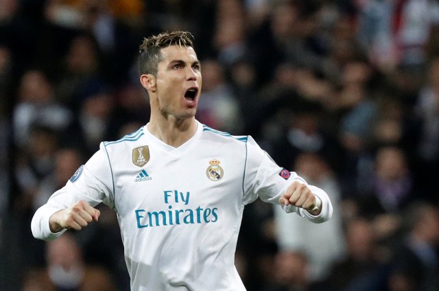 Soccer Football - Champions League Round of 16 First Leg - Real Madrid vs Paris St Germain - Santiago Bernabeu, Madrid, Spain - February 14, 2018   Real Madrid’s Cristiano Ronaldo celebrates scoring their first goal    REUTERS/Paul Hanna