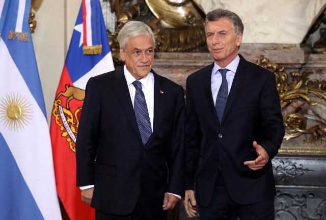 Argentine President Mauricio Macri (R) and his Chilean counterpart, Sebastian Pinera, pose for a photo at the Casa Rosada Presidential Palace in Buenos Aires, Argentina April 26, 2018. REUTERS/Marcos Brindicci
