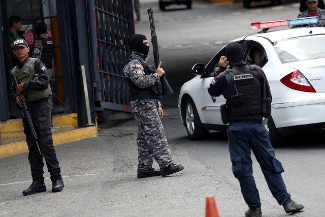 Members of the Bolivarian National Intelligence Service (SEBIN) stand guard outside a detention center of the Bolivarian National Intelligence Service (SEBIN), where a riot occurred, according to relatives, in Caracas, Venezuela May 16, 2018. REUTERS/Carlos Garcia Rawlins