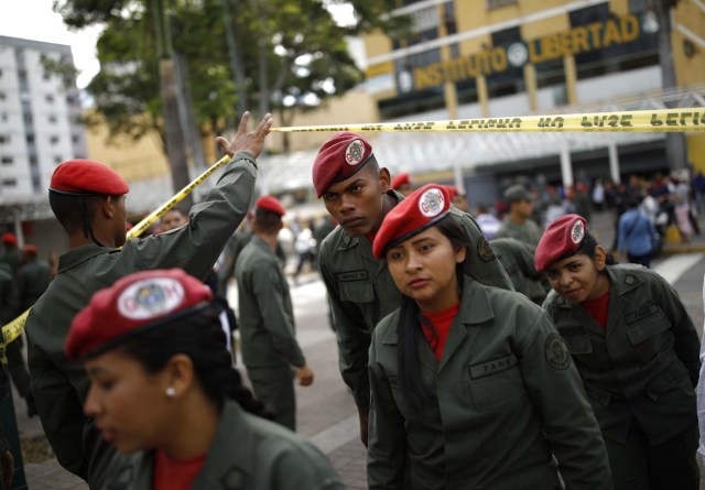 Venezuelan soldiers arrive at a polling station during the presidential election in Caracas, Venezuela, May 20, 2018. REUTERS/Carlos Garcia Rawlins